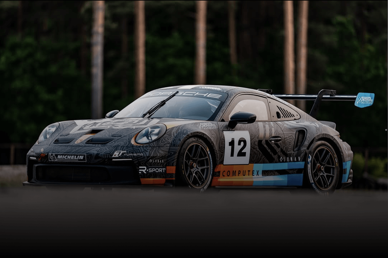 Porsche race car competing on track during racing event